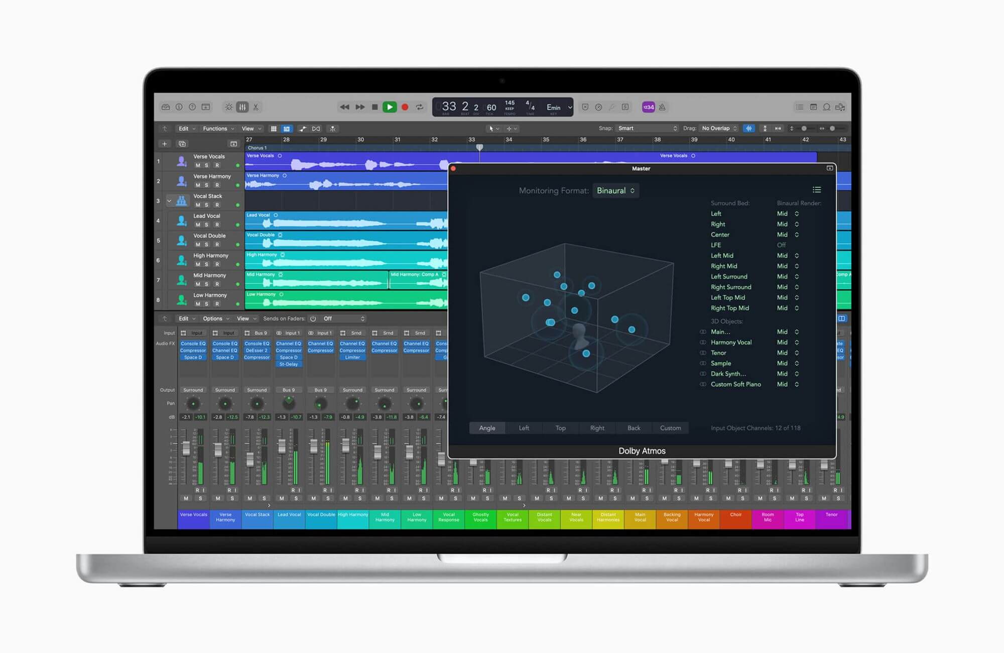 Laptop showing audio editing software and Dolby Atmos controls.