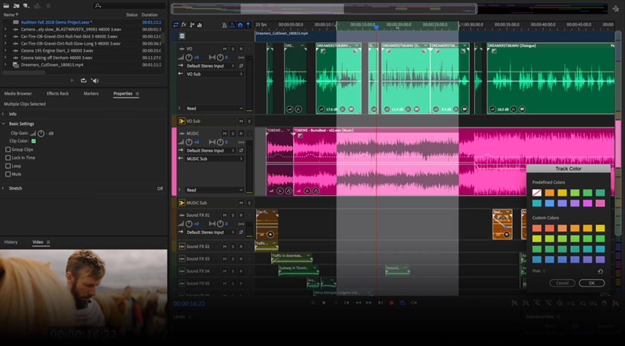 Audio editing timeline with color-coded tracks and waveform clips.