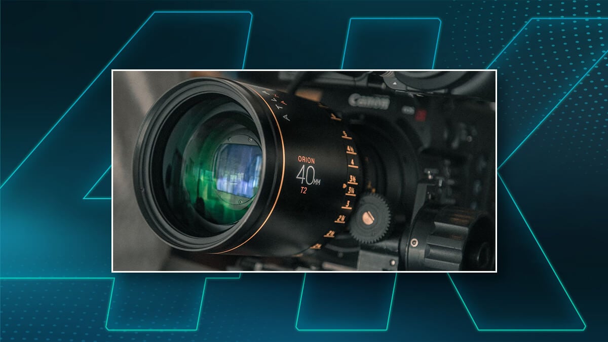 Close-up of a cinema camera lens framed over a blue graphic background.