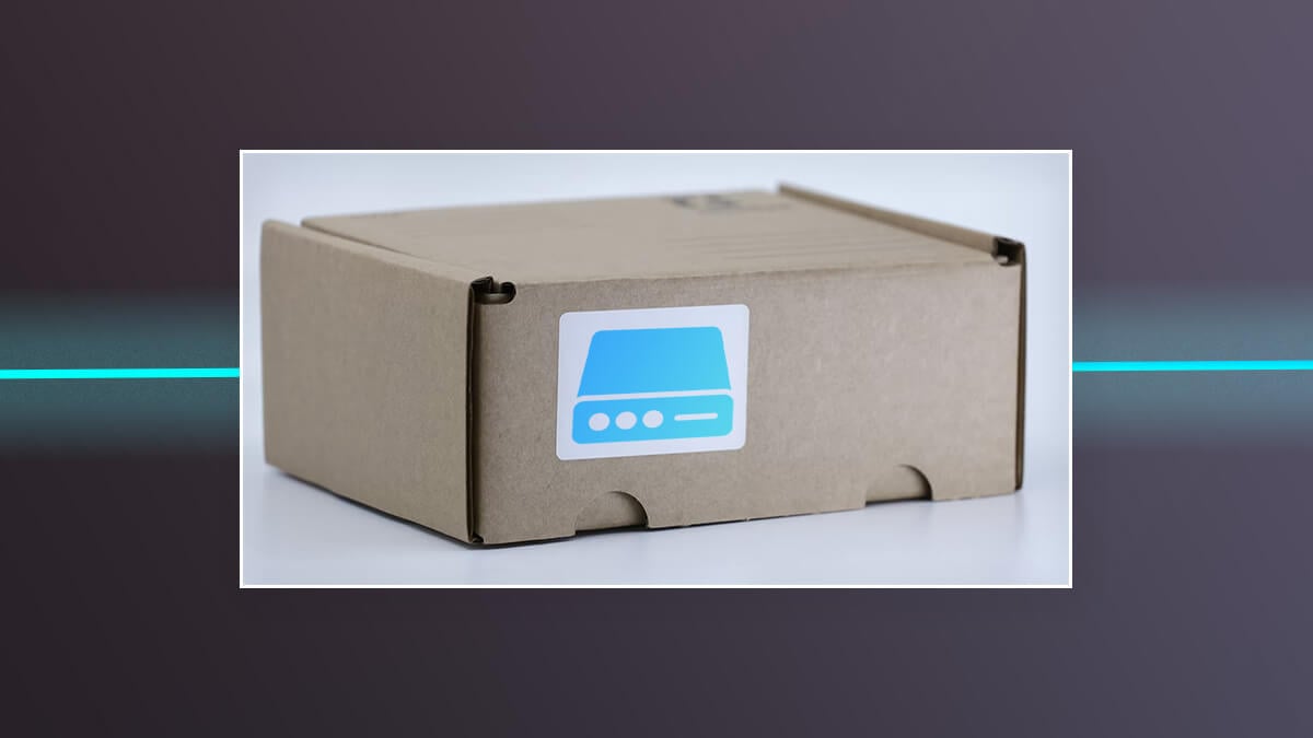Cardboard box with a blue hard drive icon sticker on the front.