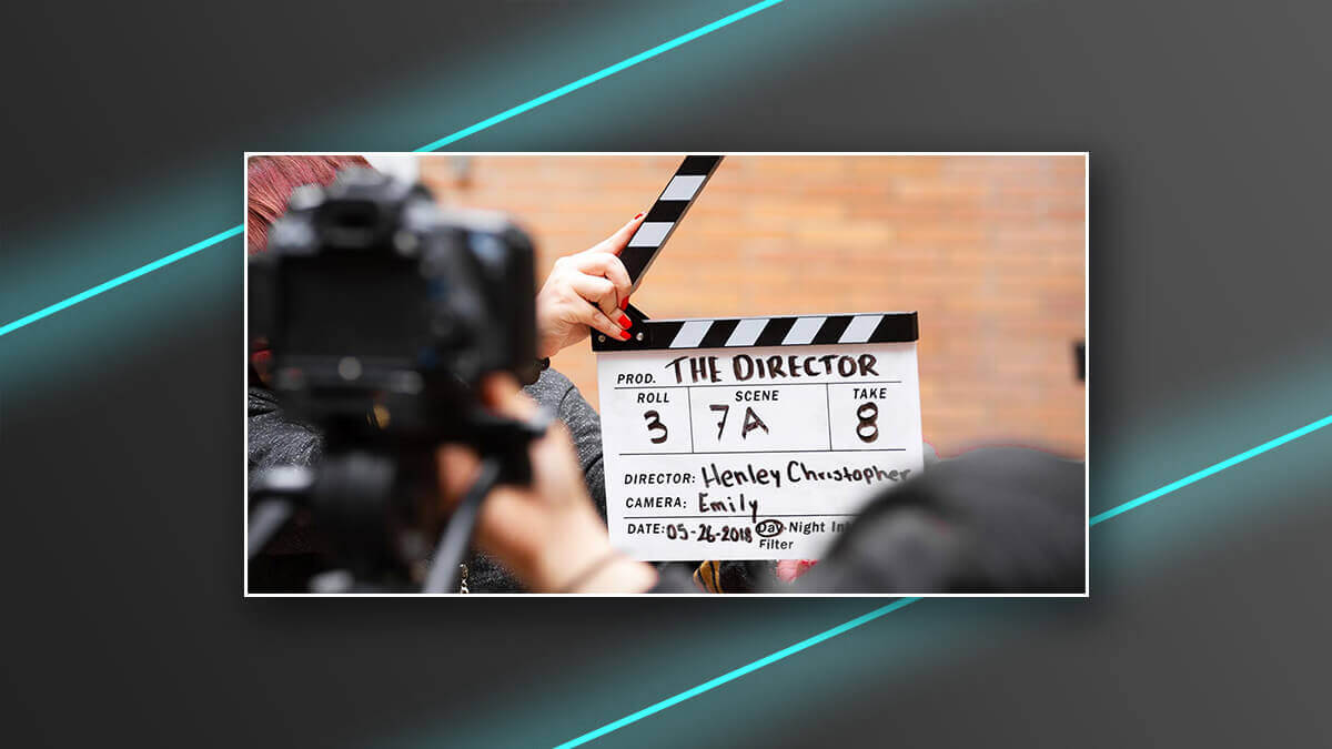 Film clapperboard held in front of a camera during a shoot.