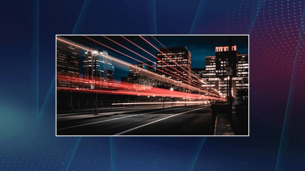  Night city street with long light trails from moving traffic, illustrating high-speed transmission.