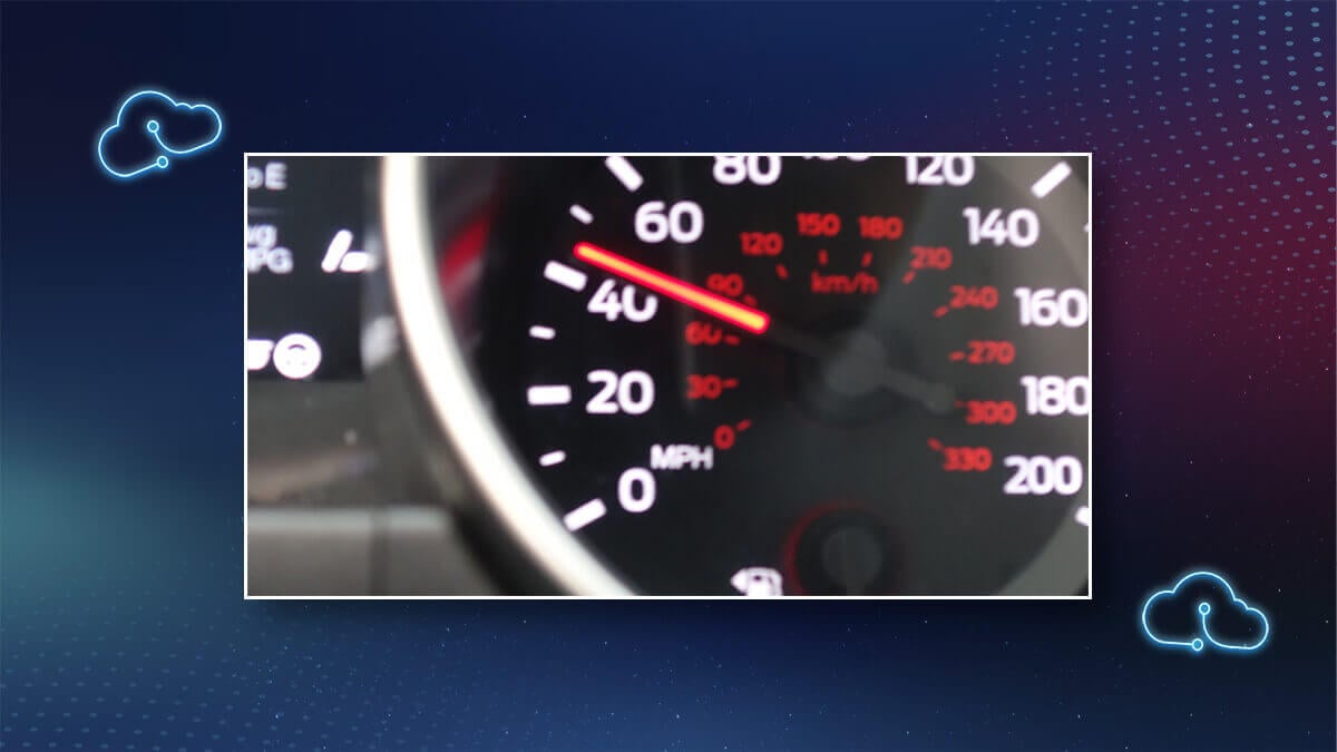 Close-up of a speedometer needle, symbolizing transfer speed.