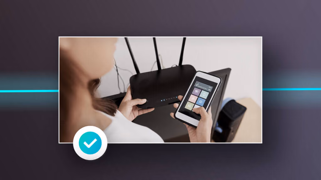 Person holding a Wi‑Fi router and smartphone, with a blue checkmark icon.