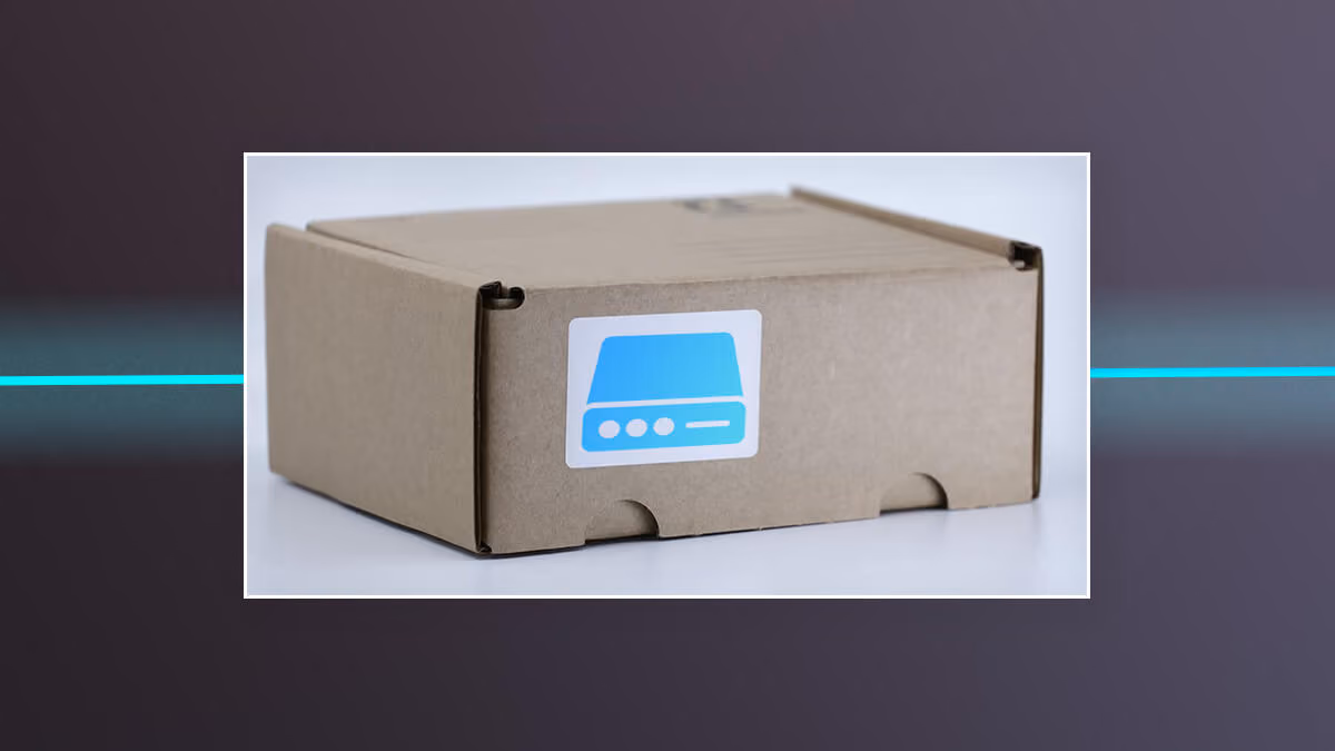 Cardboard box with a blue hard drive icon sticker on the front.