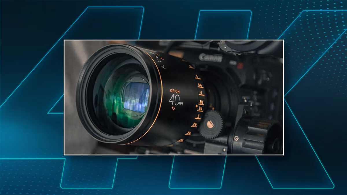 Close-up of a cinema camera lens framed over a blue graphic background.